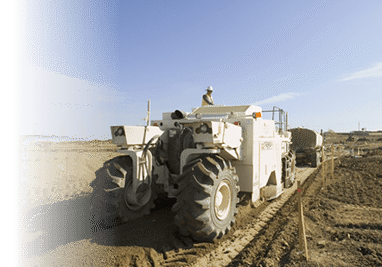Tire-mounted soil recycler working on construction site